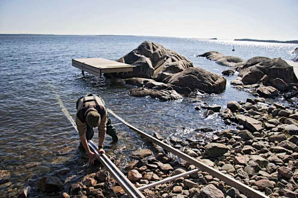 Installation of a large boat dock in the archipelago.